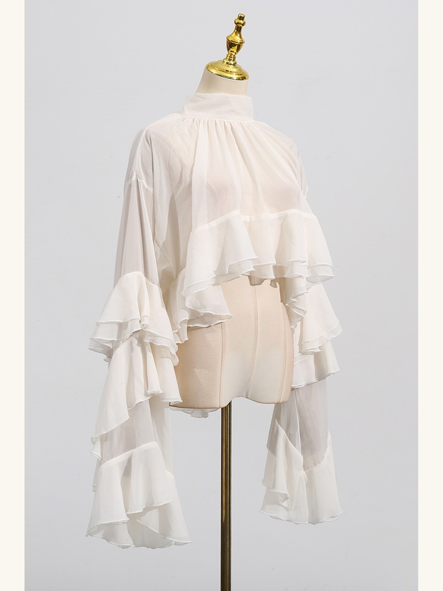 Ruffled sheer mock-neck blouse
