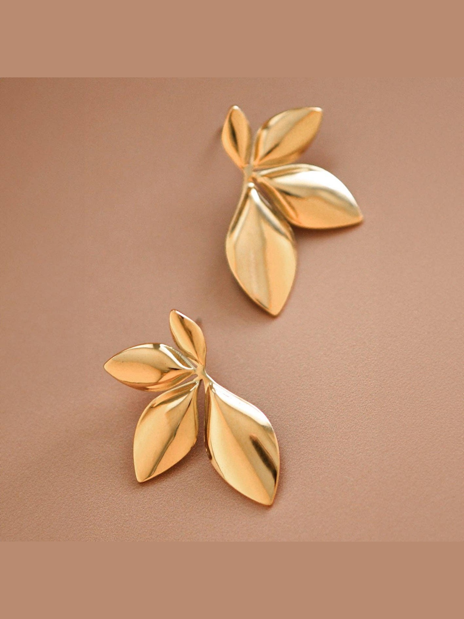 Gold leaf statement stud earrings